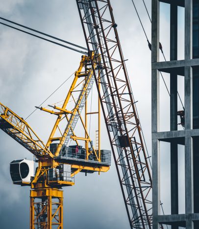Construction tower cranes on a building site
